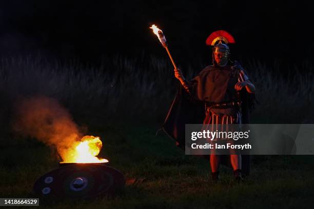 Roman soldier re-enactor poses for pictures following a night attack battle at Chesters Roman Fort on August 27, 2022 in Hexham, United Kingdom. 2022...