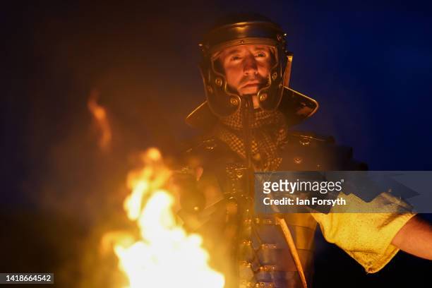Roman soldier re-enactor poses for pictures following a night attack battle at Chesters Roman Fort on August 27, 2022 in Hexham, United Kingdom. 2022...