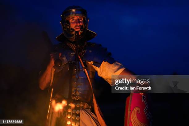 Roman soldier re-enactor poses for pictures following a night attack battle at Chesters Roman Fort on August 27, 2022 in Hexham, United Kingdom. 2022...