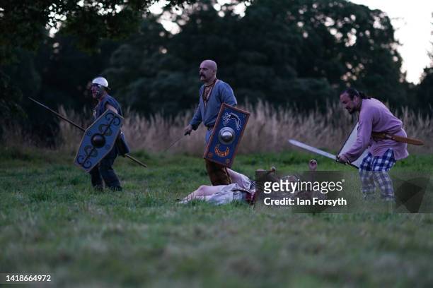 Barbarian re-enactors battle Roman soldiers during a Night Attack at Chesters Roman Fort on August 27, 2022 in Hexham, United Kingdom. 2022 is the...