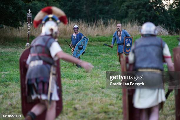 Roman soldiers and Barbarian re-enactors take part in rehearsals ahead of a Night Attack at Chesters Roman Fort on August 27, 2022 in Hexham, United...