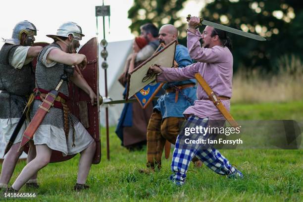 Roman soldiers and Barbarian re-enactors take part in rehearsals ahead of a Night Attack at Chesters Roman Fort on August 27, 2022 in Hexham, United...