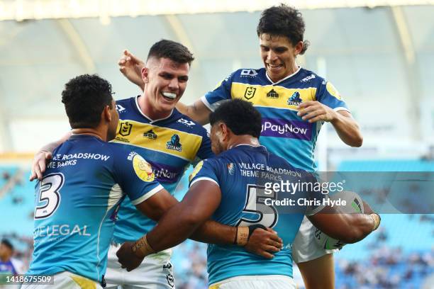 Greg Marzhew of the Titans celebrates a try during the round 24 NRL match between the Gold Coast Titans and the Newcastle Knights at Cbus Super...