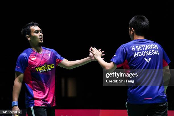 Mohammad Ahsan and Hendra Setiawan of Indonesia react in the Men's Doubles Final match against Aaron Chia and Soh Wooi Yik of Malaysia on day seven...