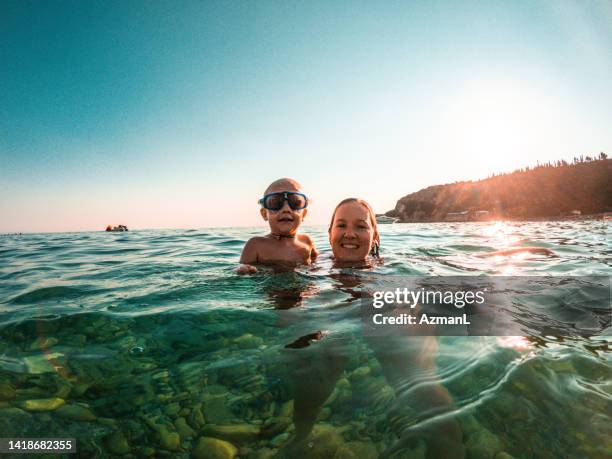 happy selfie of mother and kid during the sunset - albania stock pictures, royalty-free photos & images