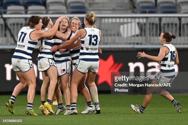 Cats players celebrate after Georgie Prespakis of the Cats kicked the winning goal during the round one AFLW match between the Geelong Cats and the...