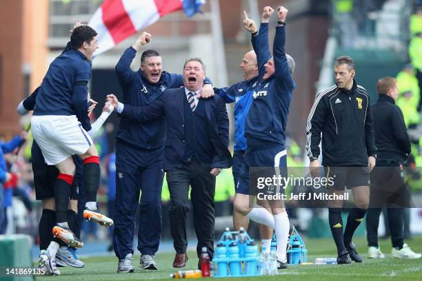 Ally McCoist, coach of Rangers, celebrates a goal during the Scottish Clydesdale Bank Scottish Premier League match between Rangers and Celtic at...