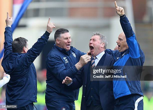 Ally McCoist coach of Rangers celebrates a goal during the Scottish Clydesdale Bank Scottish Premier League match between Rangers and Celtic at Ibrox...