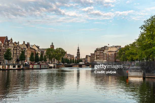 amsterdam summer sunrise - amsterdam sunrise stockfoto's en -beelden