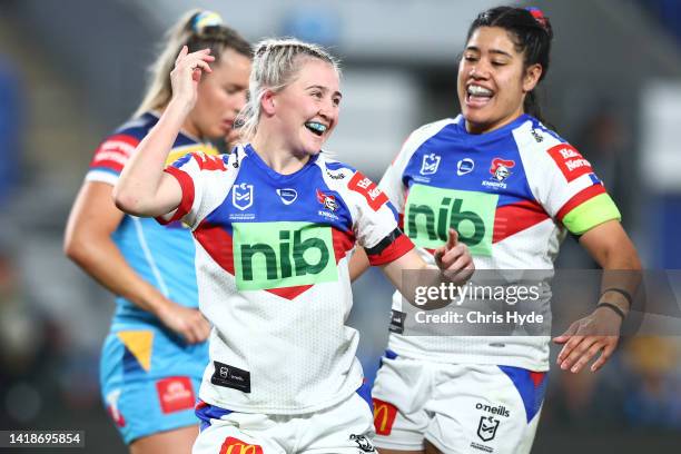 Emma Manzelmann of the Knights celebrates a try during the round two NRLW match between Gold Coast Titans and Newcastle Knights at Cbus Super...