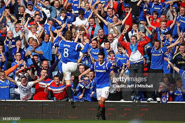 Rangers fans celebrate a goal by Lee Wallace during the Scottish Clydesdale Bank Scottish Premier League match between Rangers and Celtic at Ibrox...