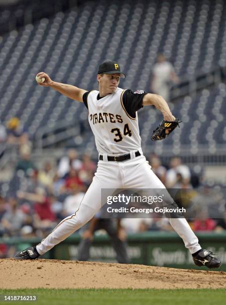 Pitcher Kris Benson of the Pittsburgh Pirates pitches against the San Diego Padres during a Major League Baseball game at PNC Park on May 19, 2004 in...