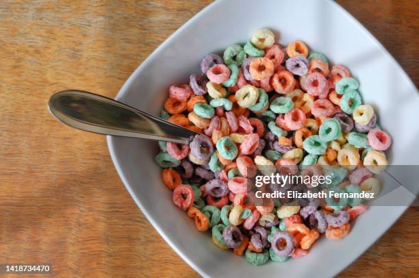 bowl of colorful loops cereals - cereali da colazione foto e immagini stock