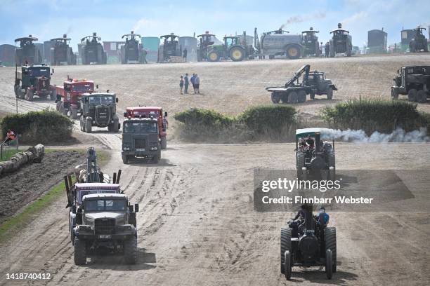 Exhibitors drive their steam road locomotive engines and vintage vehicles in the main arena at the Great Dorset Steam Fair, on August 28, 2022 in...