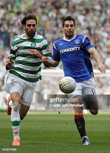 Carlos Bocanegra of Rangers tackles Georgios Samaras of Celtic during the Scottish Clydesdale Bank Scottish Premier League match between Rangers and...