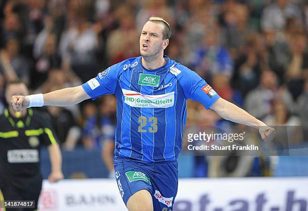 Pascal Hens of Hamburg celebrates during the EHF Champions League match between HSV Hamburg and Fuechse Berlin at the O2 World on March 25, 2012 in...