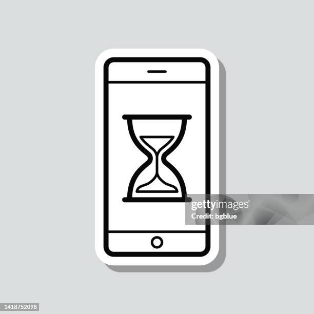 smartphone with hourglass. icon sticker on gray background - waiting icon stock illustrations