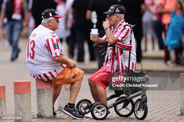 Fans of 1. FC Koln arrive at the stadium prior to the Bundesliga match between 1. FC Köln and VfB Stuttgart at RheinEnergieStadion on August 28, 2022...