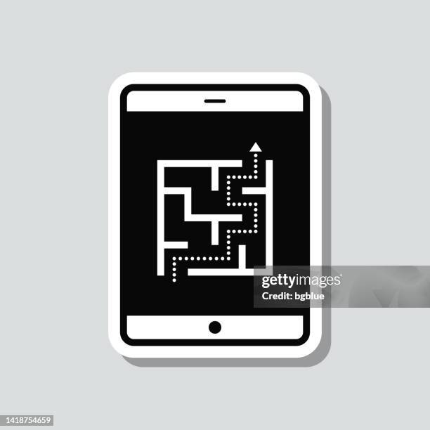 tablet pc with maze. icon sticker on gray background - simple maze stock illustrations