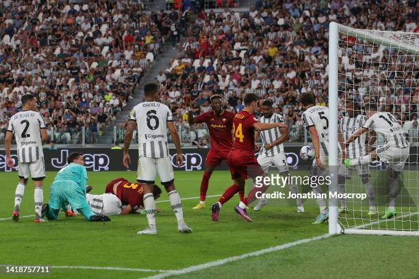Tammy Abraham and Marash Kumbulla of AS Roma close in as Arkadiusz Milik of Juventus clears the ball off the goalline as his team mates Mattia De...