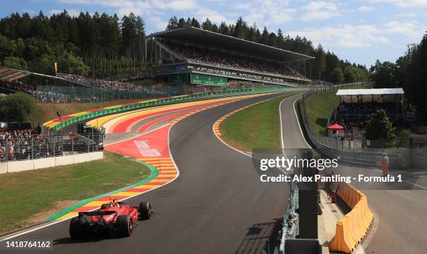 Carlos Sainz of Spain driving the Ferrari F1-75 makes his way to the grid during the F1 Grand Prix of Belgium at Circuit de Spa-Francorchamps on...