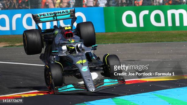Lewis Hamilton of Great Britain driving the Mercedes AMG Petronas F1 Team W13 lands on the run off area after a crash during the F1 Grand Prix of...