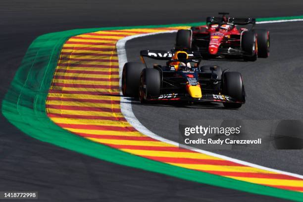 Max Verstappen of the Netherlands driving the Oracle Red Bull Racing RB18 leads Charles Leclerc of Monaco driving the Ferrari F1-75 during the F1...