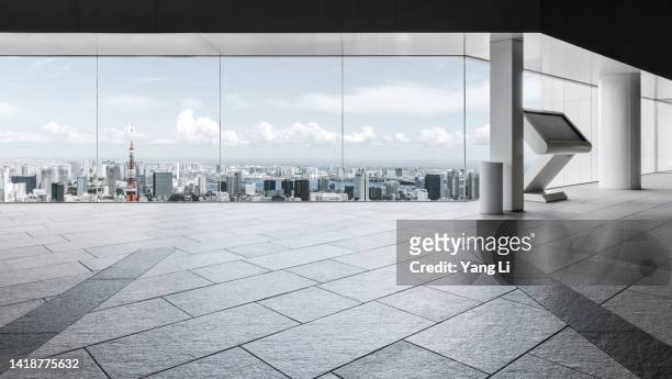 wide and low angle view of corridor in a skyscraper with the tokyo skyline - building top stock pictures, royalty-free photos & images