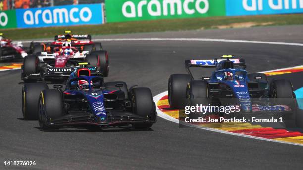 Esteban Ocon of France driving the Alpine F1 A522 Renault and Nicholas Latifi of Canada driving the Williams FW44 Mercedes battle for track position...