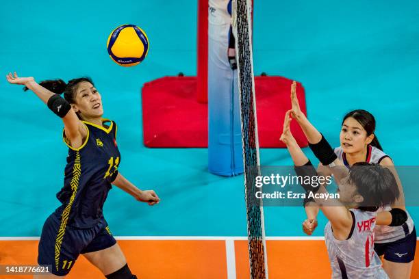 Hoang Thi Kieu Trinh of Team Vietnam spikes the ball during their semi-final round match against Team Japan on day seven of the AVC Cup For Women at...