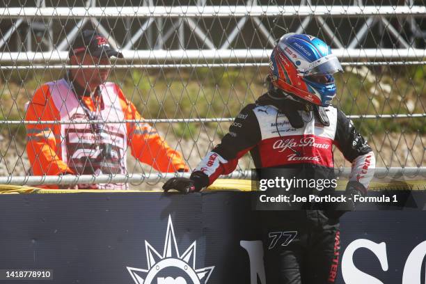 Valtteri Bottas of Finland and Alfa Romeo F1 looks on from the barrier after retiring from the race during the F1 Grand Prix of Belgium at Circuit de...