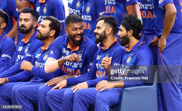 Virat Kohli of India shares a joke with team mates ahead of the DP World Asia Cup T20 match between Pakistan and India at Dubai International Stadium...