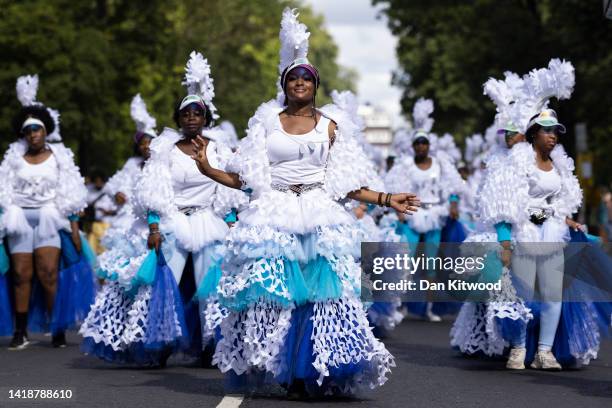 Performers process down the route during the Notting Hill carnival on August 28, 2022 in London, England. The Caribbean carnival returns to the...