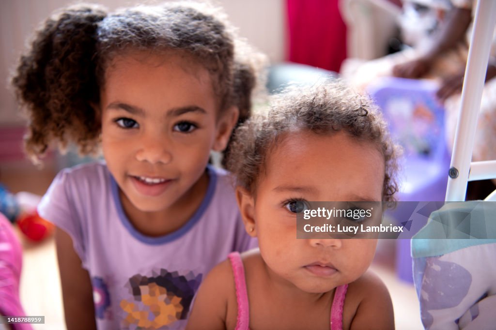 Fdh Camera Two Little Sisters Looking At The Camera One Smiling One Serious High ...