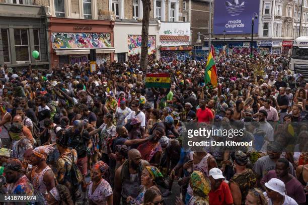 Revellers process down the route during the Notting Hill carnival on August 28, 2022 in London, England. The Caribbean carnival returns to the...