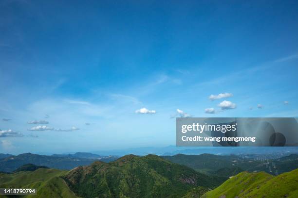 green hills under blue sky - satoyama scenery stock pictures, royalty-free photos & images