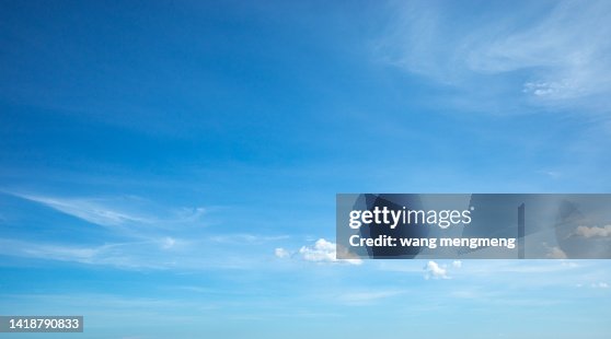 White clouds of different shapes in the blue sky White clouds of different shapes in the blue sky