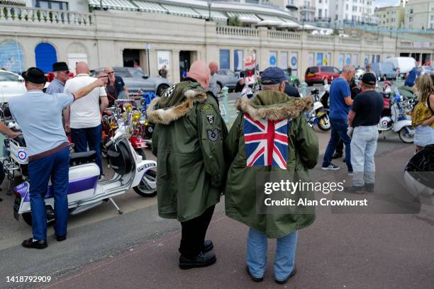 Mods enjoy a sunny day on the seafront on August 28, 2022 in Brighton, England.The Mods were a group of fans of jazz, rhythm and blues and...