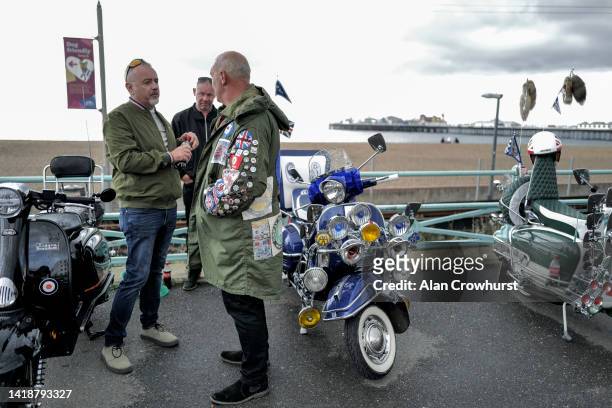 Mods enjoy a sunny day on the seafront on August 28, 2022 in Brighton, England.The Mods were a group of fans of jazz, rhythm and blues and...