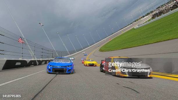Chase Elliott, driver of the A SHOC Chevrolet, and Kyle Larson, driver of the HendrickCars.com Chevrolet, lead the field on a pace lap prior to the...
