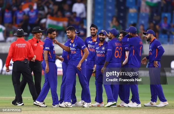 Players of India celebrate the wicket of Fakhar Zaman of Pakistan during the DP World Asia Cup T20 match between Pakistan and India at Dubai...