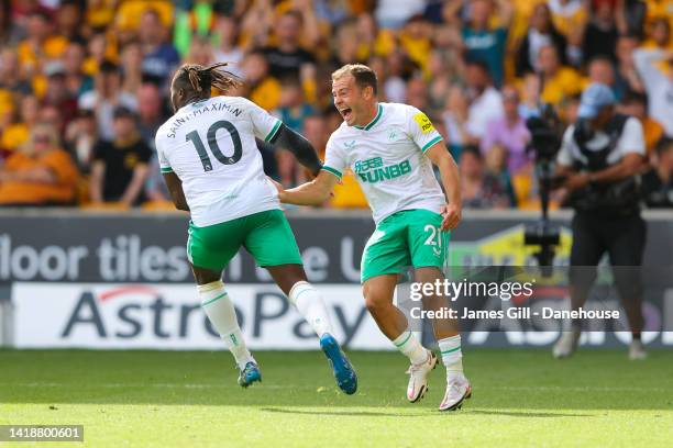 Allan Saint-Maximin of Newcastle United celebrates with Ryan Fraser of Newcastle United after scoring their side's first goal during the Premier...