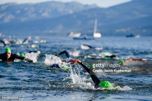 Athletes finish the swim portion during the IRONMAN Canada on August 28, 2022 in Penticton, British Columbia.