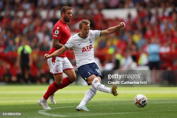 Harry Kane of Tottenham Hotspur scores their team's first goal during the Premier League match between Nottingham Forest and Tottenham Hotspur at...
