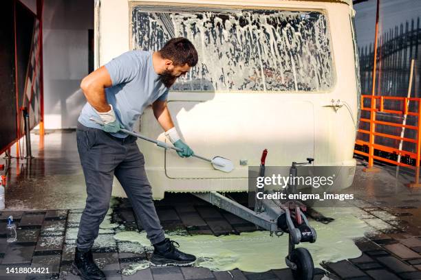 car wash worker - caravan stockfoto's en -beelden