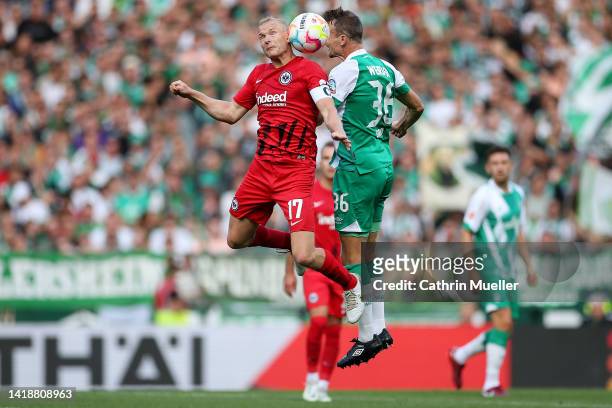 Sebastian Rode of Eintracht Frankfurt battles for a header with Lee Buchanan of Werder Bremen during the Bundesliga match between SV Werder Bremen...