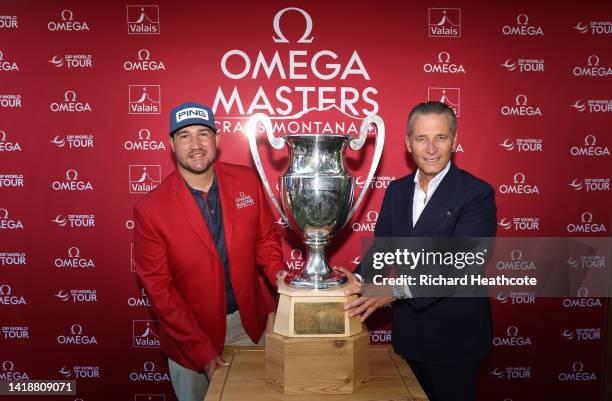 Thriston Lawrence of South Africa is presented with the trophy by Raynald Aeschlimann, OMEGA CEO and President on Day Four of the Omega European...