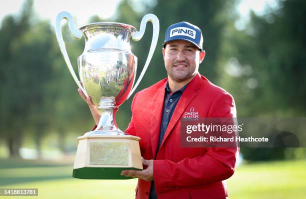 Thriston Lawrence of South Africa poses with the trophy after the prize giving on Day Four of the Omega European Masters at Crans-sur-Sierre Golf...