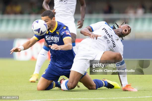 Koray Gunter of Hellas Verona FC competes for the ball with Ademola Lookman of Atalanta BC during the Serie A match between Hellas Verona and...