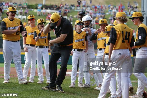 Mark Carter of the Southeast Region team from Nolensville, Tennessee dances before the Little League World Series consolation game against the...